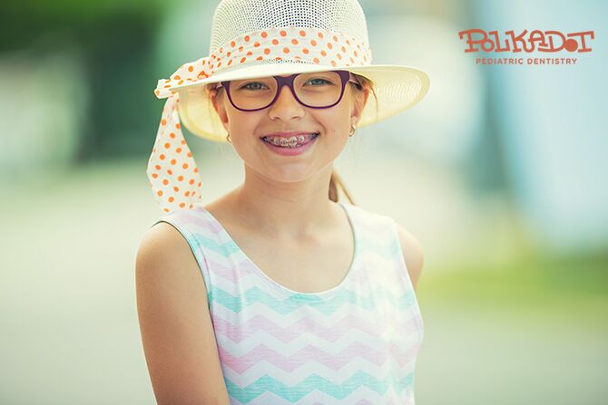 Girl smiling showing her braces